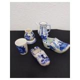 Group of vintage blue and white ceramic pieces.