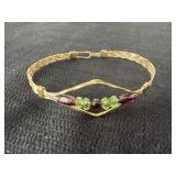 handmade wire-wrapped bangle bracelet featuring