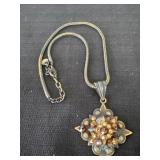 vintage gold tone chain and pendant features a