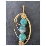 handmade gold wire-wrapped pendant