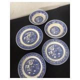 vintage Blue Willow patterned plates and bowls.