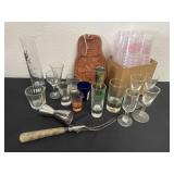 Group of glass and plastic shot glasses and misc