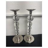 Two 16ï¿½ pillar candle holders with a silver base