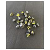 Group of black marbles with yellow and black