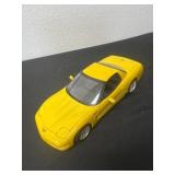 yellow 1/18 scale diecast model of a 2001