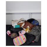 Large group of purses, colorful bags and wallets