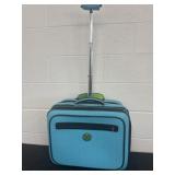 Blue small luggage with green lining on wheels