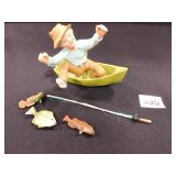 Fisherman in Boat with Fish & Rod