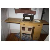 Sewing Machine in Cabinet with chair