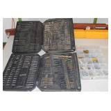 2 cases - drill bits, 1 case - bolts