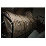 Metal folding chairs on rolling rack