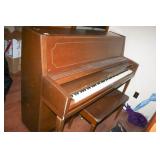 Wurlitzer piano with bench, some sheet music