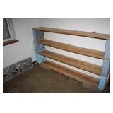 All boards and blcks shelving in small room