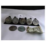 7 Eisenhower Dollars; (tarnished condition);