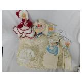Crochet blanket, doll, kitchen towels,