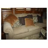 Tan upholstered Sofa with Throw pillows