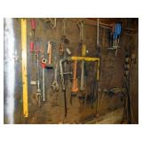 TOOLS HANGING ON WALL, PIPE THREADER