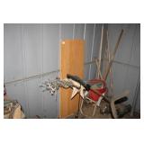 Everything on the East wall of small shed; Desk,