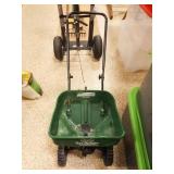 Yard Spreader and Bag of Fertilizer Yard Spreader and Bag of Fertilizer