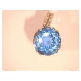 Blue pendant on silver color mount