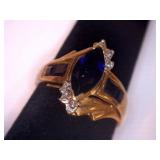 Ring marked 10K. Blue stone Marquis cut
