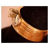 Gold ring with clear center stone