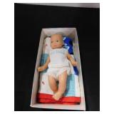 Mi Bebe rubber baby in original box with quilt