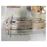 vintage wood and metal sled wood is splitting