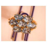 Ladies 14k Ring w/7 light blue stones