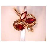 14kt GE Ladies ring w/3 ruby colored stones