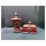 Decorative ceramic canisters featuring a red and