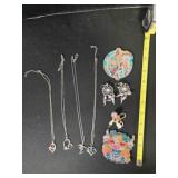 4 necklaces, earrings, keychain, resin figurines