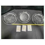 3 clear glass floral patterned plates