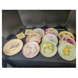 9 painted flower plates; 2 painted tiles;