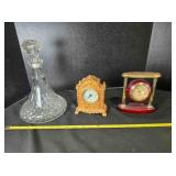 11" tall clear glass decanter and 2 clocks