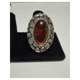 Oval amber stone with a bubble textured border