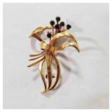 Gold tone Brooch w/Green rhinestones