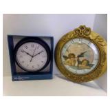 2 Plastic Wall Clocks - 1995 Waltham Gold Baby