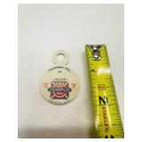 Tin Champlin Oil change reminder tag to be hung on