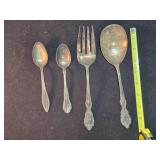 4 pieces Wm. Rogers silver plated flatware