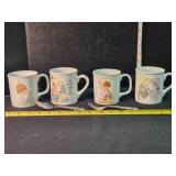 4 Precious Moments cups, spoon & fork