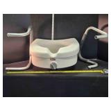 Locking raised toilet seat w/arms