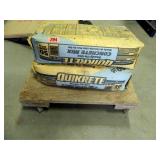 2 Bags of Quickcrete on small wooden dolly