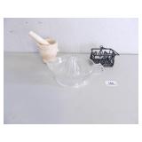 Glass juicer; mortar and pestle; black wire basket