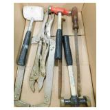 box of hammers, clamps, pry bar, etc.