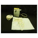 Heating pad, can opener, candle warmer