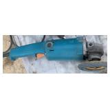 Makita grinder with sanding wheel