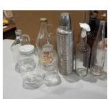 Assorted bottles and aluminum Thermos