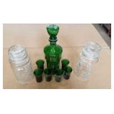 Green glass canister with 6 shot glasses and 2