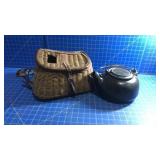 Cast iron kettle and wicker fishing basket